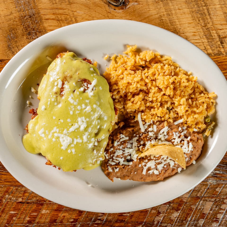 El Camino's Mexican dish with a green-sauced entree, rice, and refried beans with cheese.